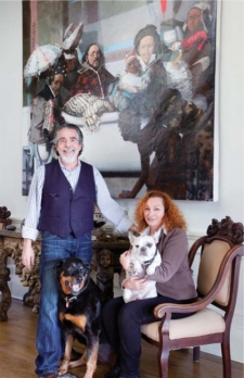 The collectors, Richard Demato and Harriet Sawyer; above them is an oil on canvas by Jamaican painter Phillip Thomas.